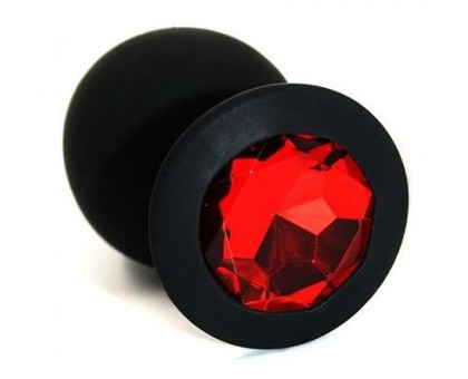 Чёрная силиконовая анальная пробка с красным кристаллом - 7 см.