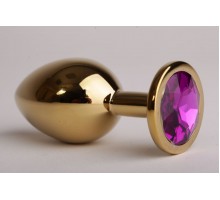 Золотистая анальная пробка с фиолетовым кристаллом - 9,5 см.