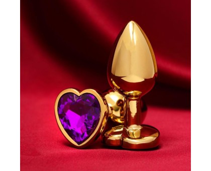 Золотистая анальная пробка с фиолетовым кристаллом в форме сердца