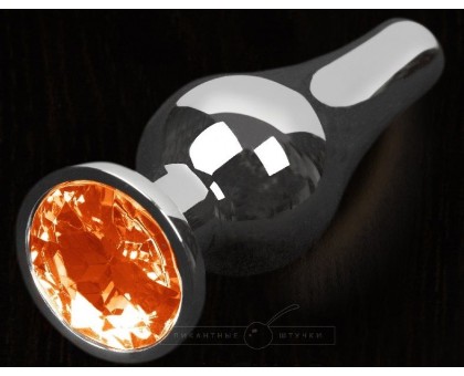 Серая анальная пробка с оранжевым кристаллом - 8,5 см.